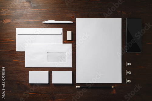 Photo of blank stationery set on wooden background. Template for branding identity. Responsive design mockup. Flat lay.