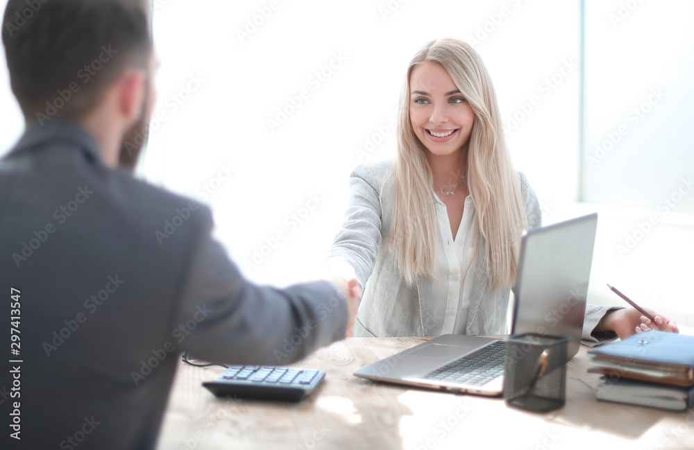 successful businesswoman shaking hands with her business partner successful businesswoman shaking hands with her business partner