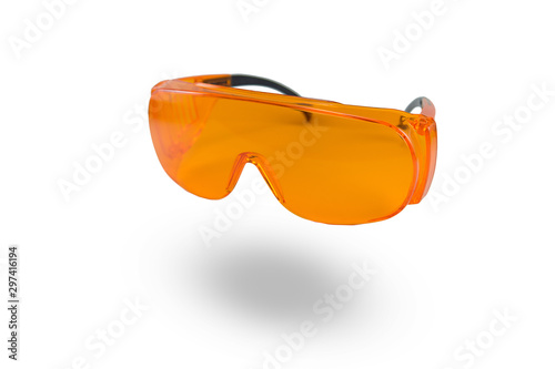 orange protective glasses in dentistry for work with UV lamp, glasses for light seals