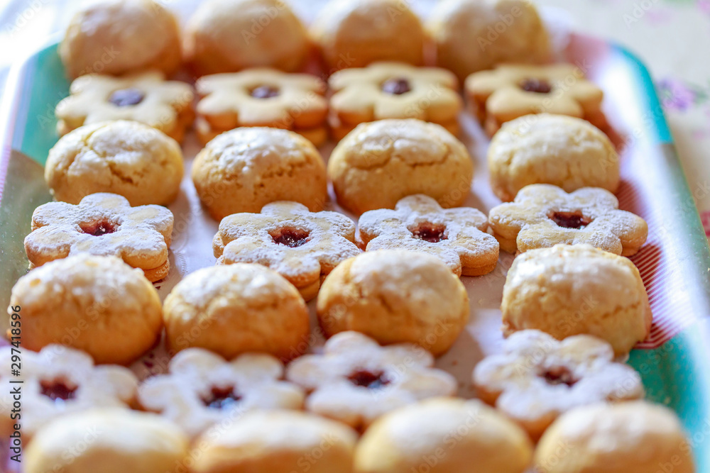 shortbread and coconut biscuits on a wood background