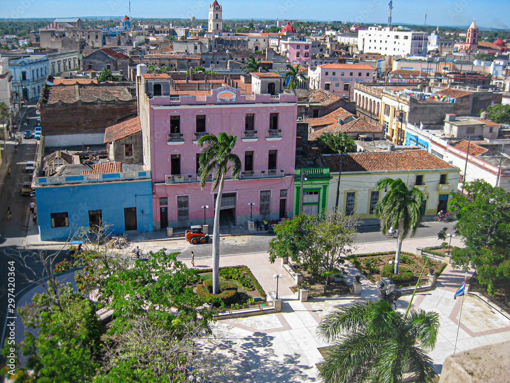 CAMAGUEY, CUBA - APRIL 30,  2009:  Bright buildings on the colonial streets in Camaguey