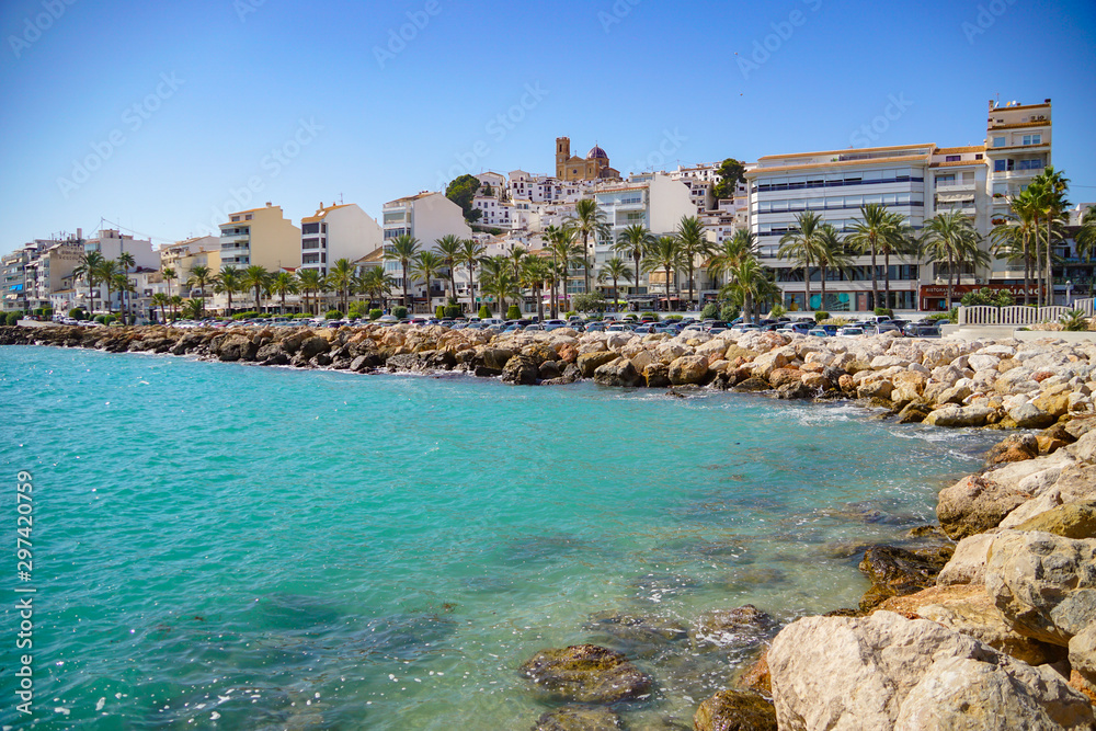 Fototapeta premium ALTEA, SPAIN - OCTOBER 4, 2019: Beautiful houses in Altea with tourist attractions and turquoise sea