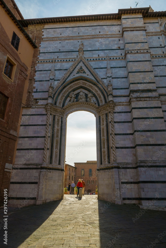 Fototapeta premium Gate to Siena Cathedral Santa Maria Assunta (Duomo di Siena) in Siena, Tuscany