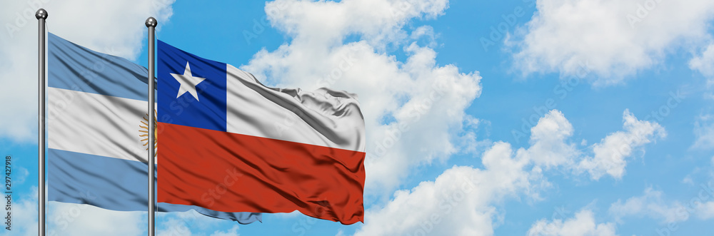 Argentina and Chile flag waving in the wind against white cloudy blue sky together. Diplomacy concept, international relations. Argentina and Chile flag waving in the wind against white cloudy blue sky together. Diplomacy concept, international relations.