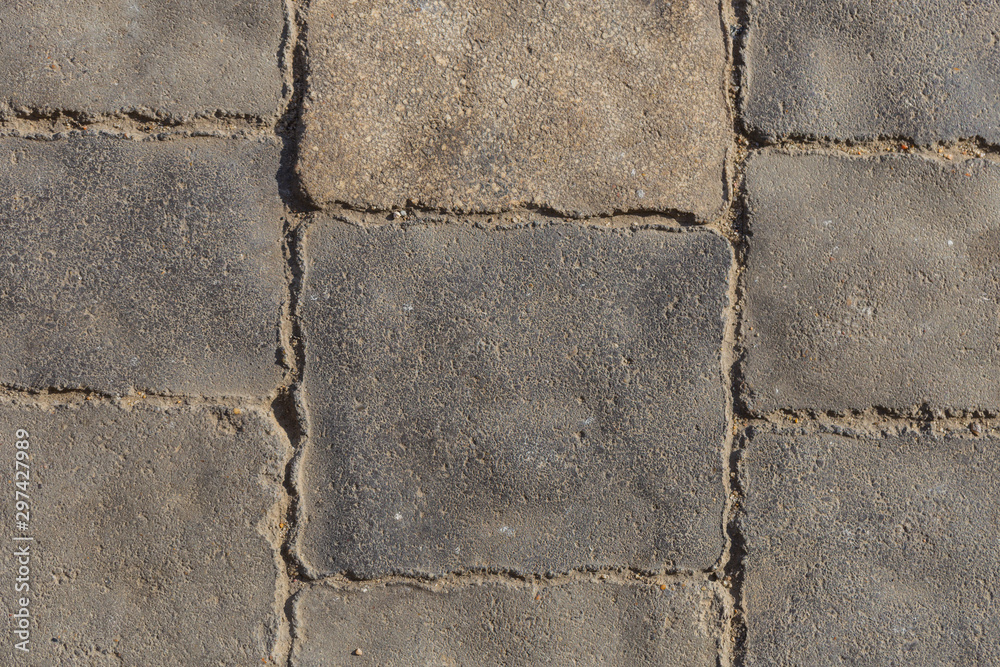 Obraz premium Paving from tiles. Graphic element on a stone. Construction product.
