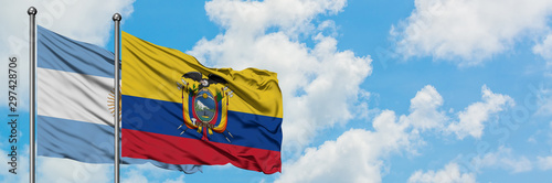 Argentina and Ecuador flag waving in the wind against white cloudy blue sky together. Diplomacy concept, international relations.