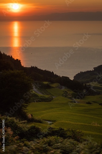 sunset on coast of sea