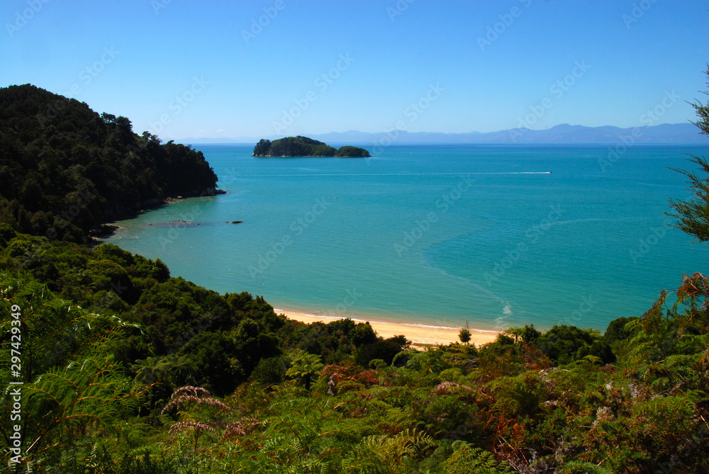 view from the Abel Tasman Coast Track to bay with turquoise waters view from the Abel Tasman Coast Track to bay with turquoise waters