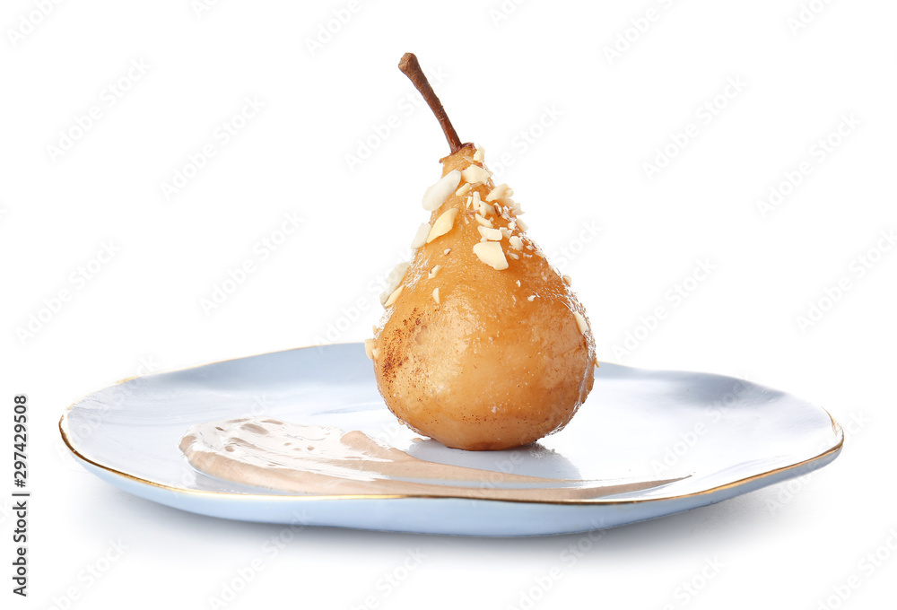 Fototapeta premium Plate with tasty cooked pear on white background