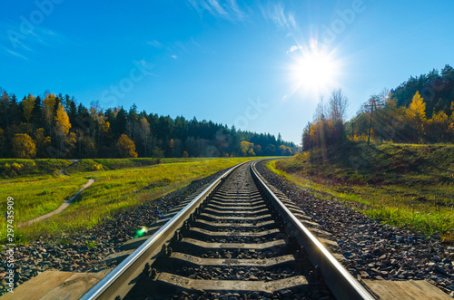 railway track in the autumn forest. railway in the autumn evening