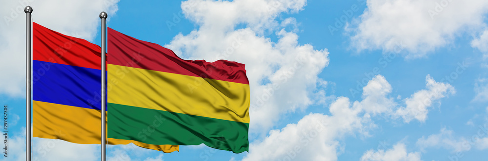 Armenia and Bolivia flag waving in the wind against white cloudy blue sky together. Diplomacy concept, international relations. Armenia and Bolivia flag waving in the wind against white cloudy blue sky together. Diplomacy concept, international relations.