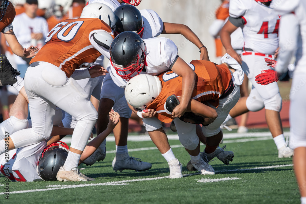 Great action photos of football players making amazing plays during a football game Great action photos of football players making amazing plays during a football game