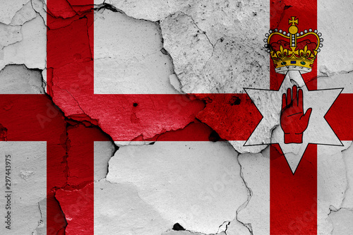 flags of England and Northern Ireland painted on cracked wall