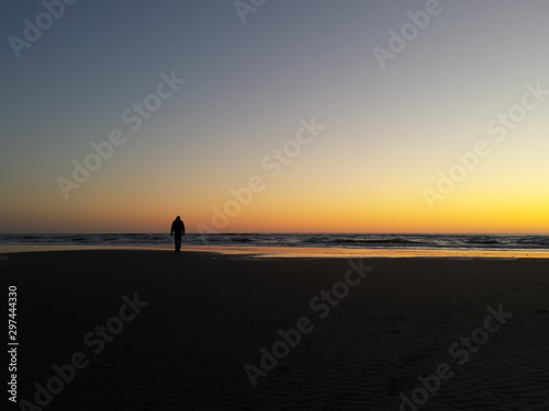 silhouette against the ocean sunset © Jillian