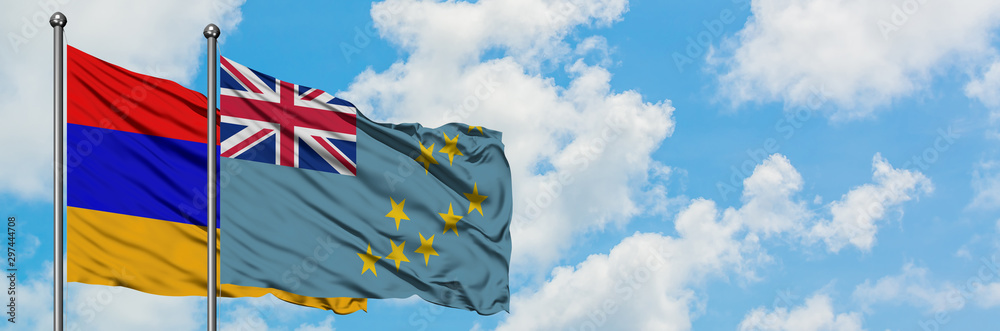 Armenia and Tuvalu flag waving in the wind against white cloudy blue sky together. Diplomacy concept, international relations. Armenia and Tuvalu flag waving in the wind against white cloudy blue sky together. Diplomacy concept, international relations.