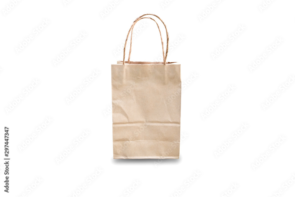 Brown paper bag with handles isolated on white background in vertical format. Room for your advertising text. Front view. Brown paper bag with handles isolated on white background in vertical format. Room for your advertising text. Front view.