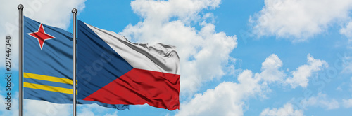 Aruba and Czech Republic flag waving in the wind against white cloudy blue sky together. Diplomacy concept, international relations.
