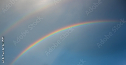 Rainbow over field © noon@photo