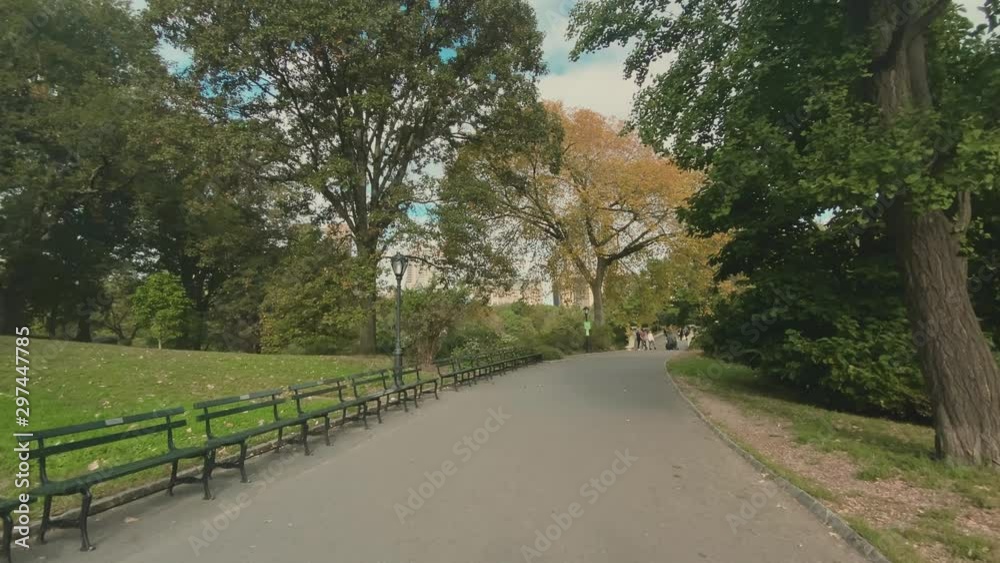 A personal perspective walking on a path in Manhattan's Central Park headed towards the Bow Bridge on an overcast Autumn day. A personal perspective walking on a path in Manhattan's Central Park headed towards the Bow Bridge on an overcast Autumn day.