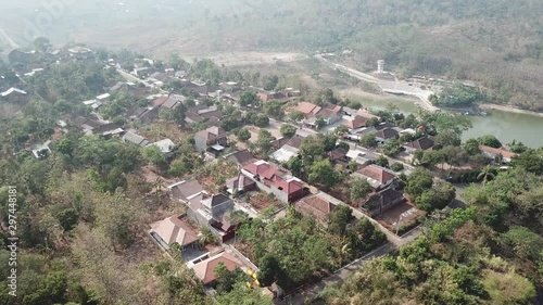 Aerial of Village and jatibarang reservoir, Gunungpati, semarang city, central java, tracking photo