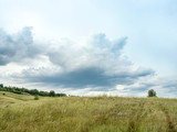 autumn landscape of fields and large Cumulus clouds