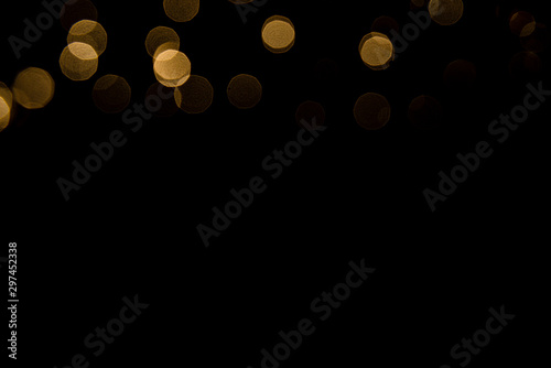Abstract gold bokeh with black background photo