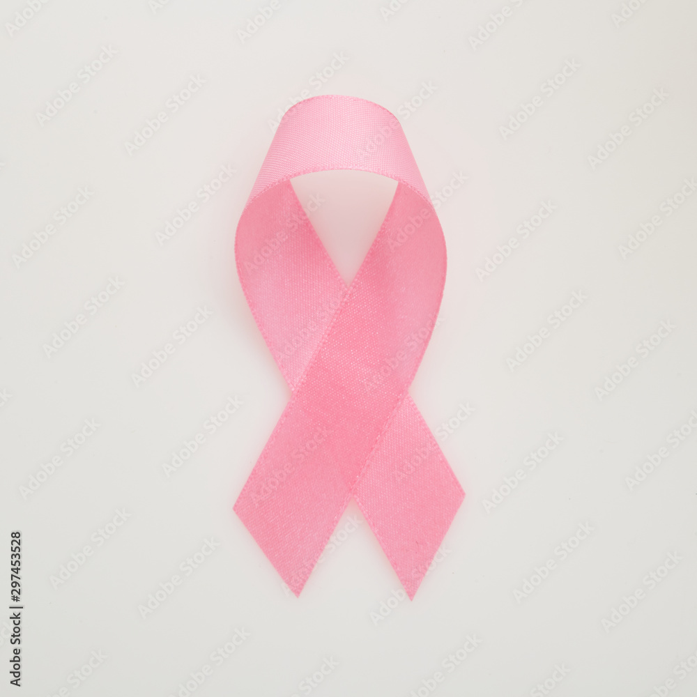Pink breast cancer ribbon on white