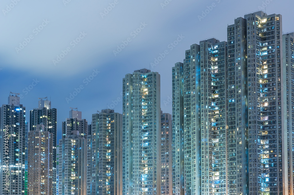 High rise residential buiilding in Hong Kong city at night
