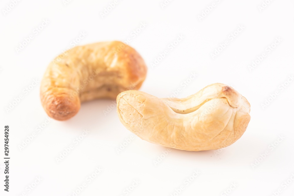 Fototapeta premium Cashew nuts isolated against white