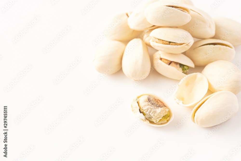 Pistachio nuts isolated against white
