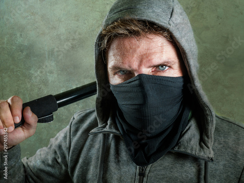 Fotografija young man as fanatic and aggressive ultra anarchist rioter