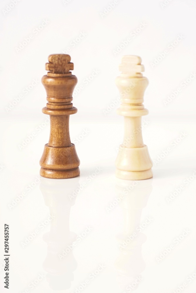 wooden chess pieces isolated against white wooden chess pieces isolated against white