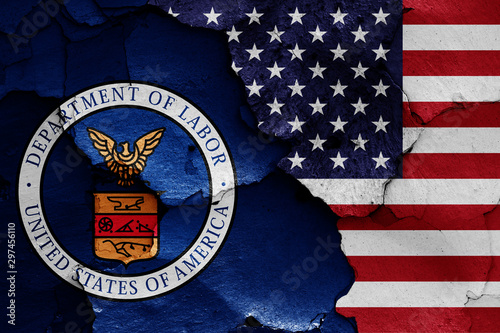 flags of Department of Labor and USA painted on cracked wall