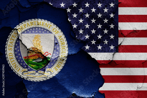 flags of Department of Agriculture and USA painted on cracked wall photo