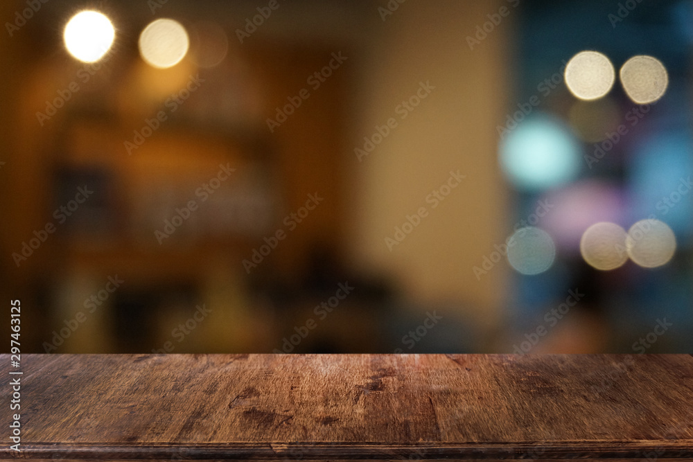 Empty dark wooden table in front of abstract blurred bokeh background of restaurant . can be used for display or montage your products.Mock up for space.