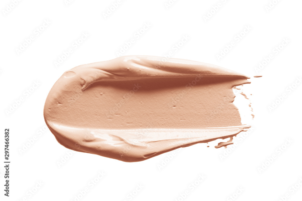 Makeup foundation, concealer swatch smudge smear isolated on white background. Nude make up base brushstroke, swipe. Light brown liquid powder cream texture