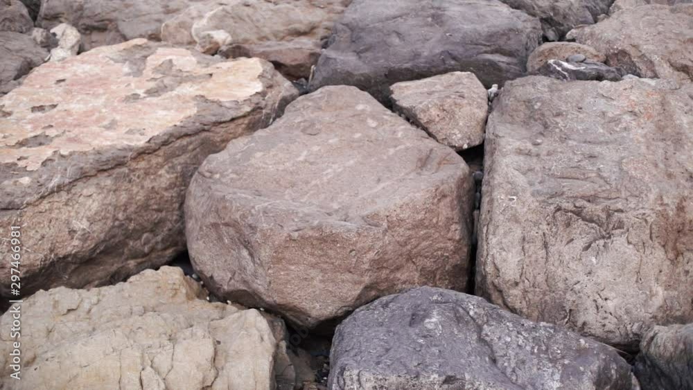 big rocks stacked near each other , rocks and stones background , rocky beach , abstract of huge rocks boulder . big rocks stacked near each other , rocks and stones background , rocky beach , abstract of huge rocks boulder .