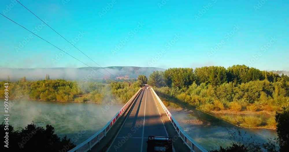 aerial view of bridges with mountains and lakes