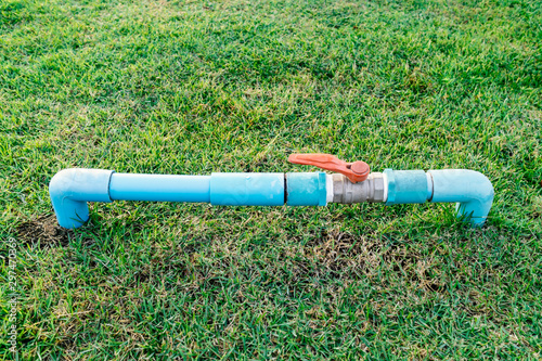 PVC water valve with pipeline in backyard or garden