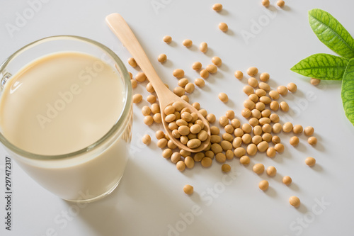 Soy milk and soy bean it on white table background healthy concept. Benefits of Soy.