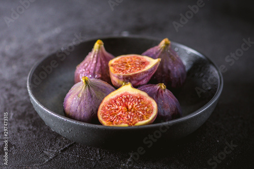 Close up view of fresh figs on dark background