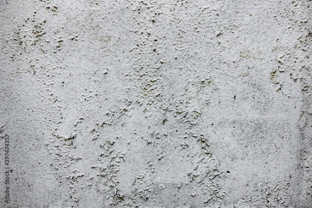 Texture of a concrete wall with cracks and scratches which can be used as a background Texture of a concrete wall with cracks and scratches which can be used as a background