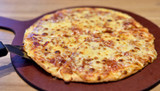 Hot pizza on wooden tray, Four cheese pizza