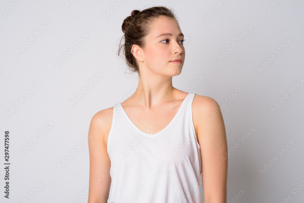 Face of young beautiful woman with hair tied thinking Face of young beautiful woman with hair tied thinking