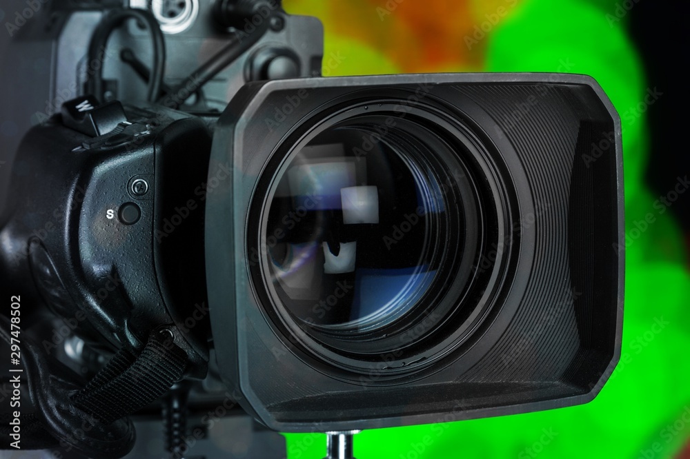 Professional video camera on dark background