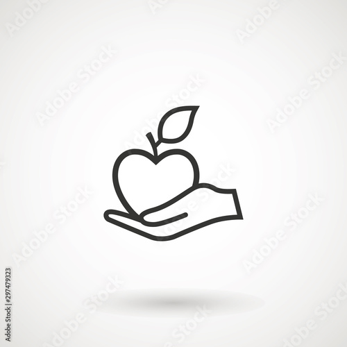 Apple in hand icon. Hand holding an apple, logo on white background.