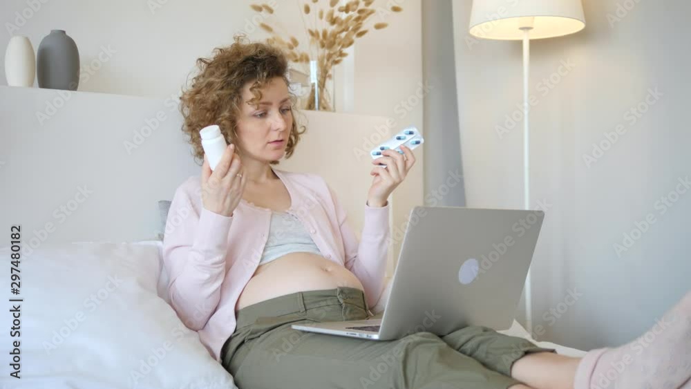 Pregnant Woman Consult A Doctor Online Using Laptop. Pregnant Woman Consult A Doctor Online Using Laptop.