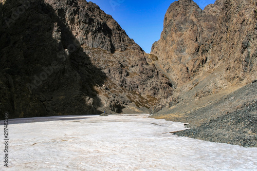 Icy entrance of the Yolyn Am or Yoliin Am canyon in spring,  Gobi Gurvansaikhan National Park. Gobi desert, Mongolia.