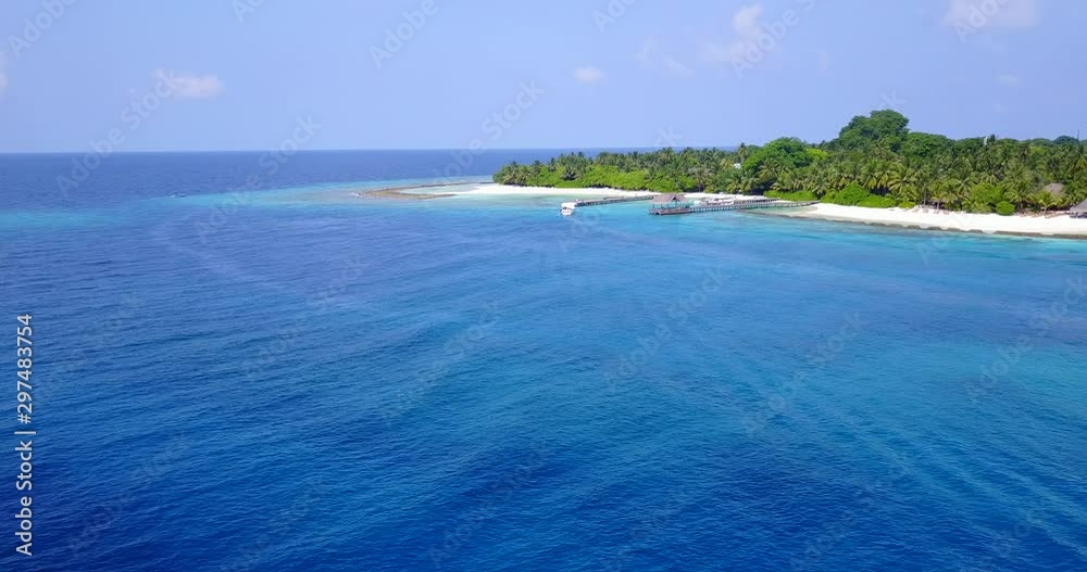 Luxurious sail boat off the coast of luscious island in the Bahamas Luxurious sail boat off the coast of luscious island in the Bahamas