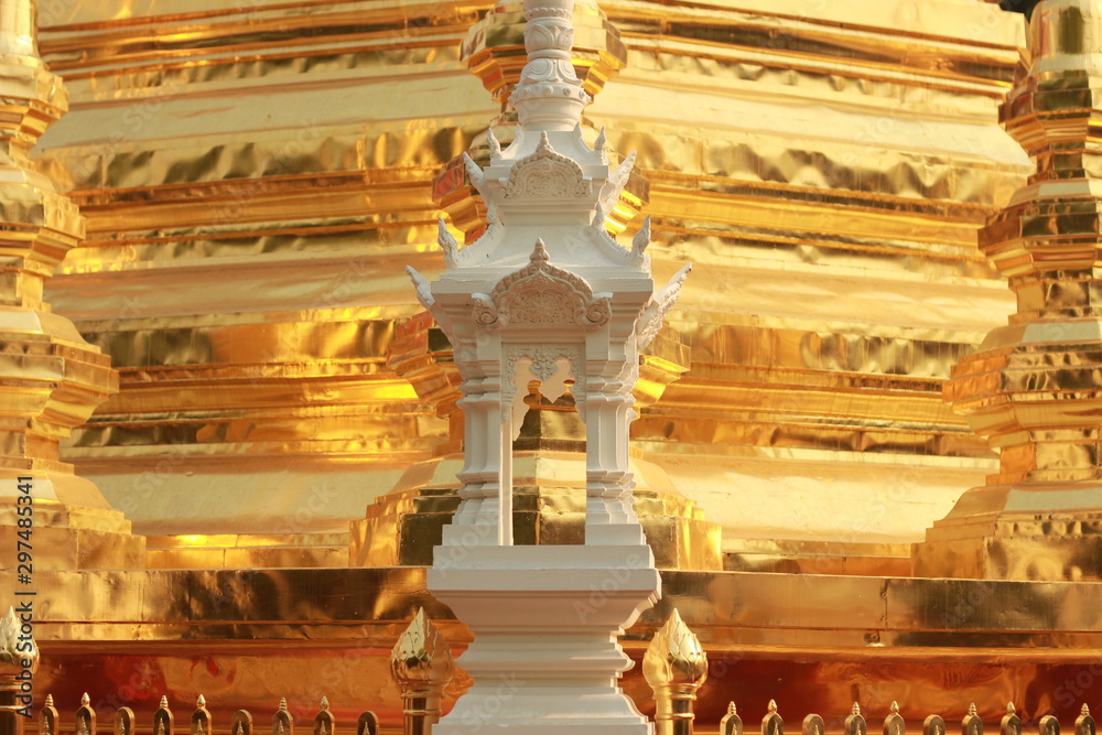 Fototapeta premium architectural details and carvings at an ancient teak timber Thai Buddhist temple in Northern Thailand showing traditional patterns and designs of a religious building, Southeast Asia